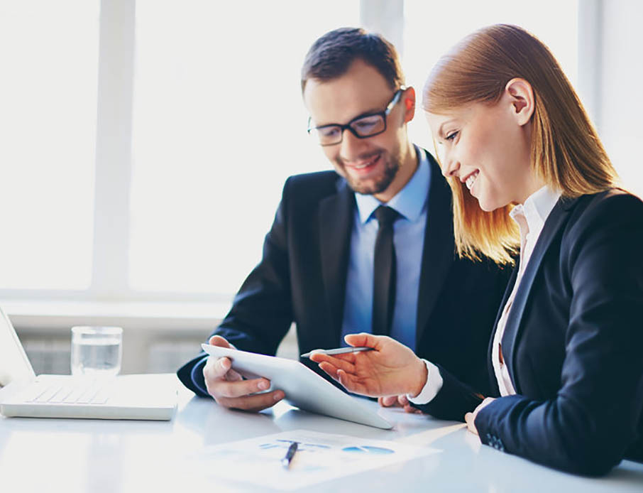 two people looking at tablet